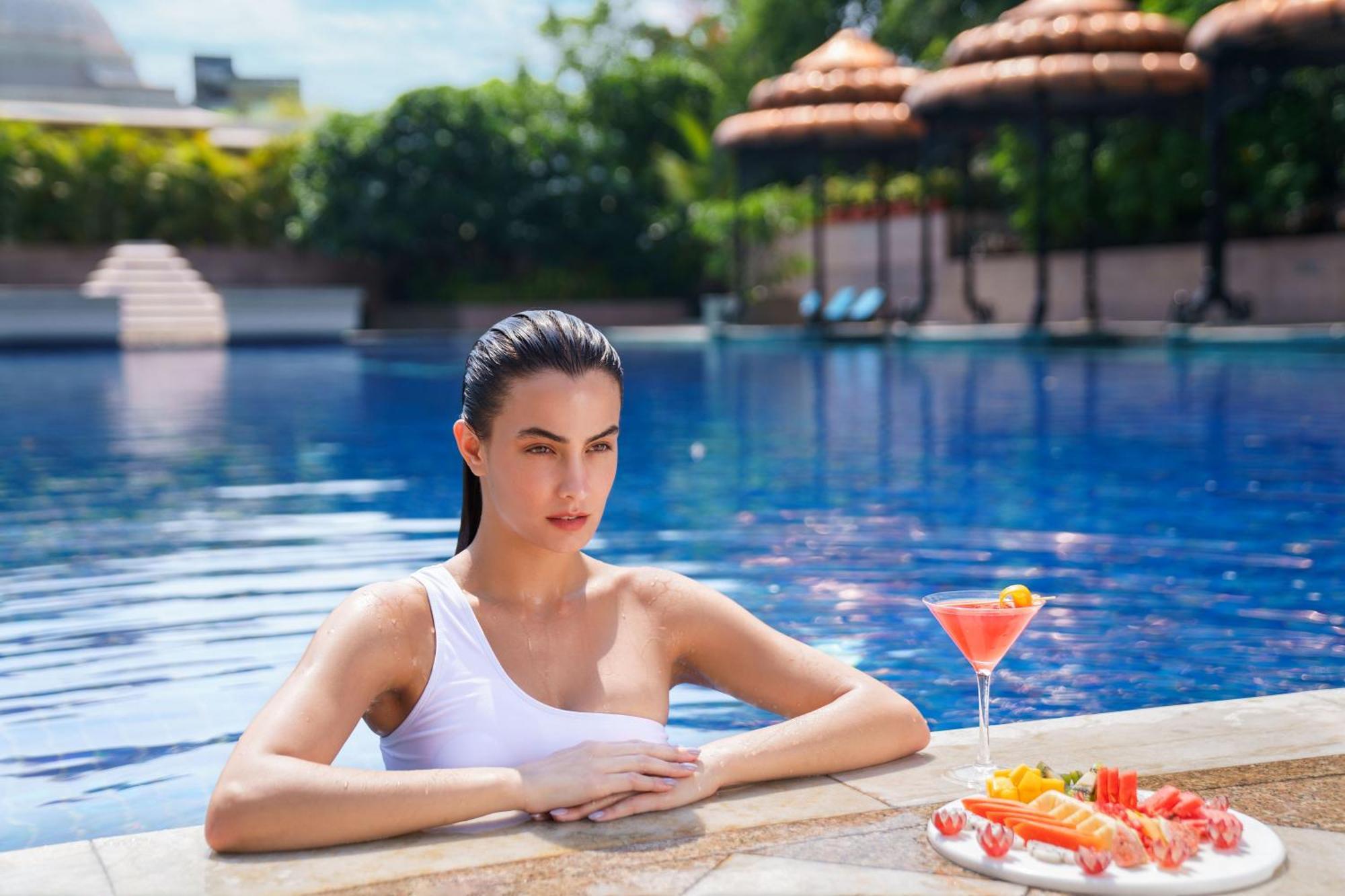 Taj Krishna Hotel Hyderabad Exterior photo A woman in a swimming pool